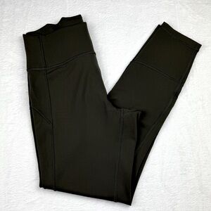 Lululemon Olive Green Leggings. Rear slit pocket. Size 8. Excellent condition.